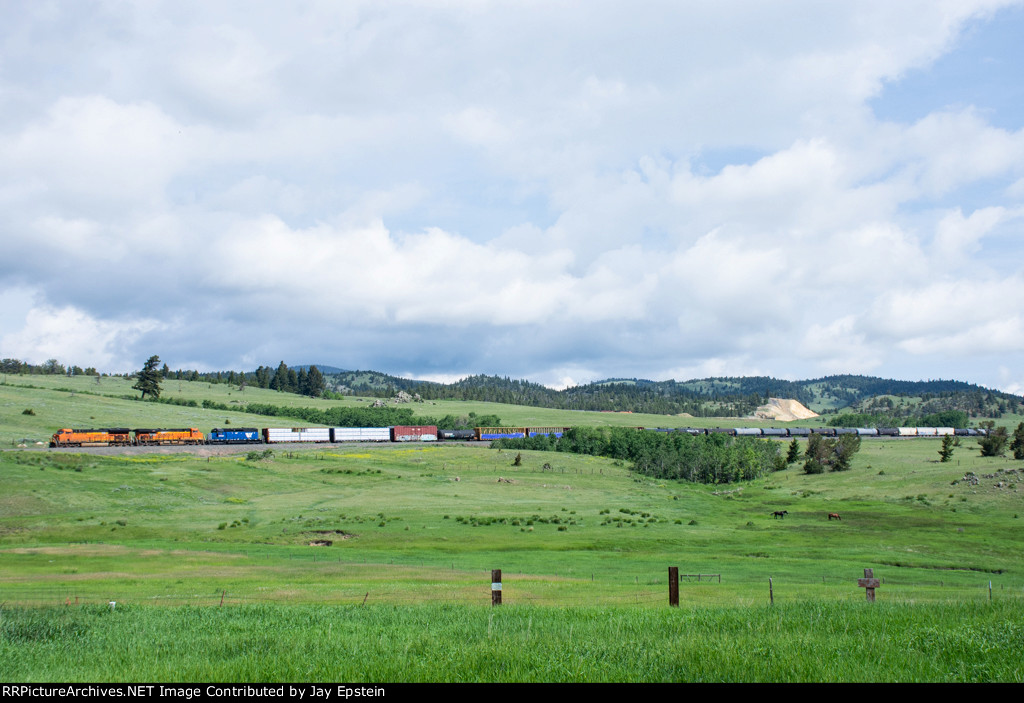 An eastbound manifest descends Mullan Pass. 